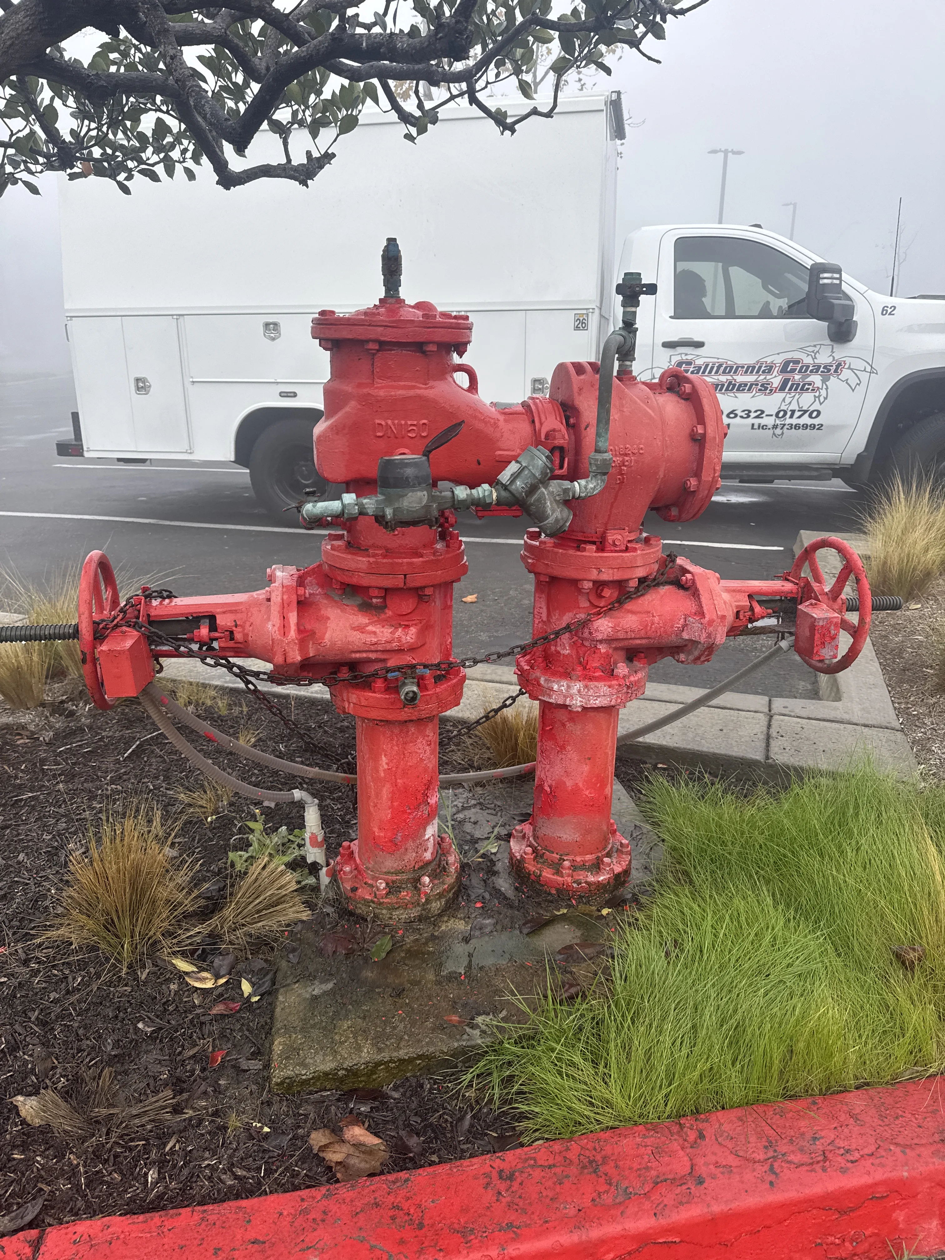 California Coast Plumbers truck parked at a commercial standpipe connection