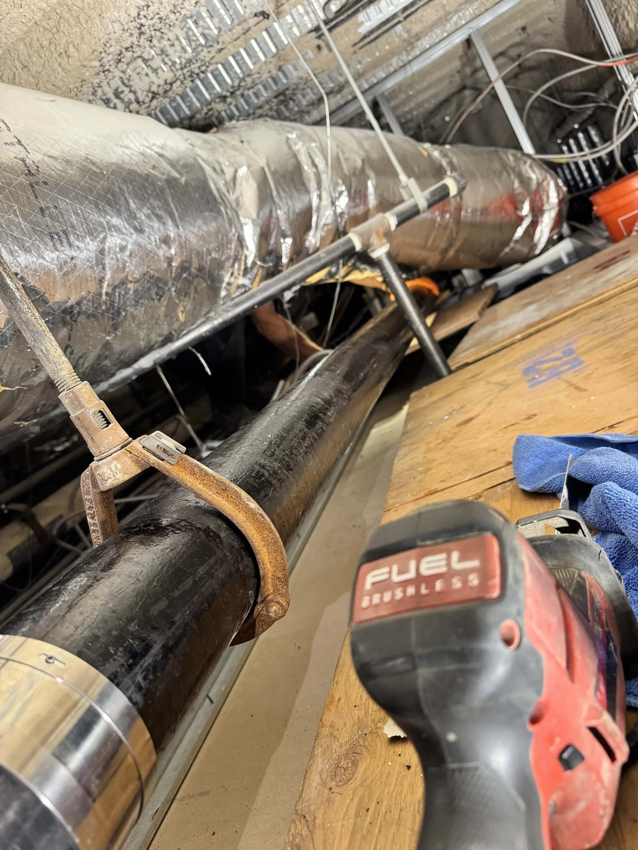 Commercial plumbing maintenance and pipe repair in progress